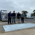 SALEYARDS manager, David Wallis shows LRTAV vice-president, Trevor Fry how the new system works.